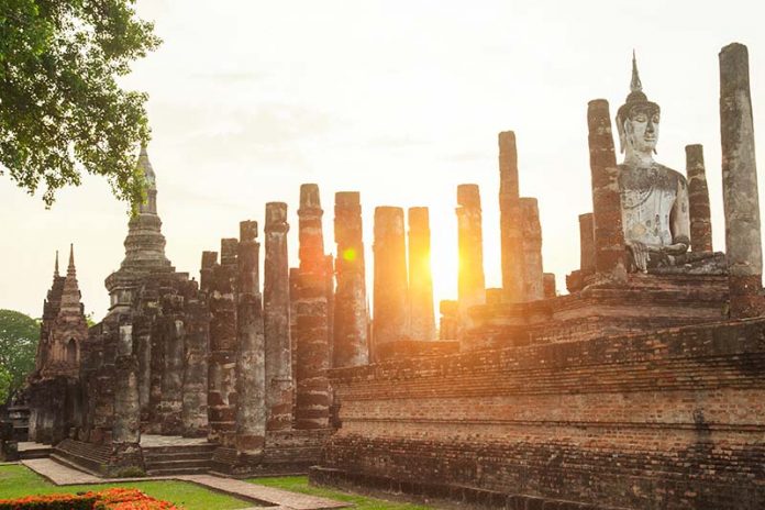 Buddha sculpture and temple ruins in Sukhothai historical park,